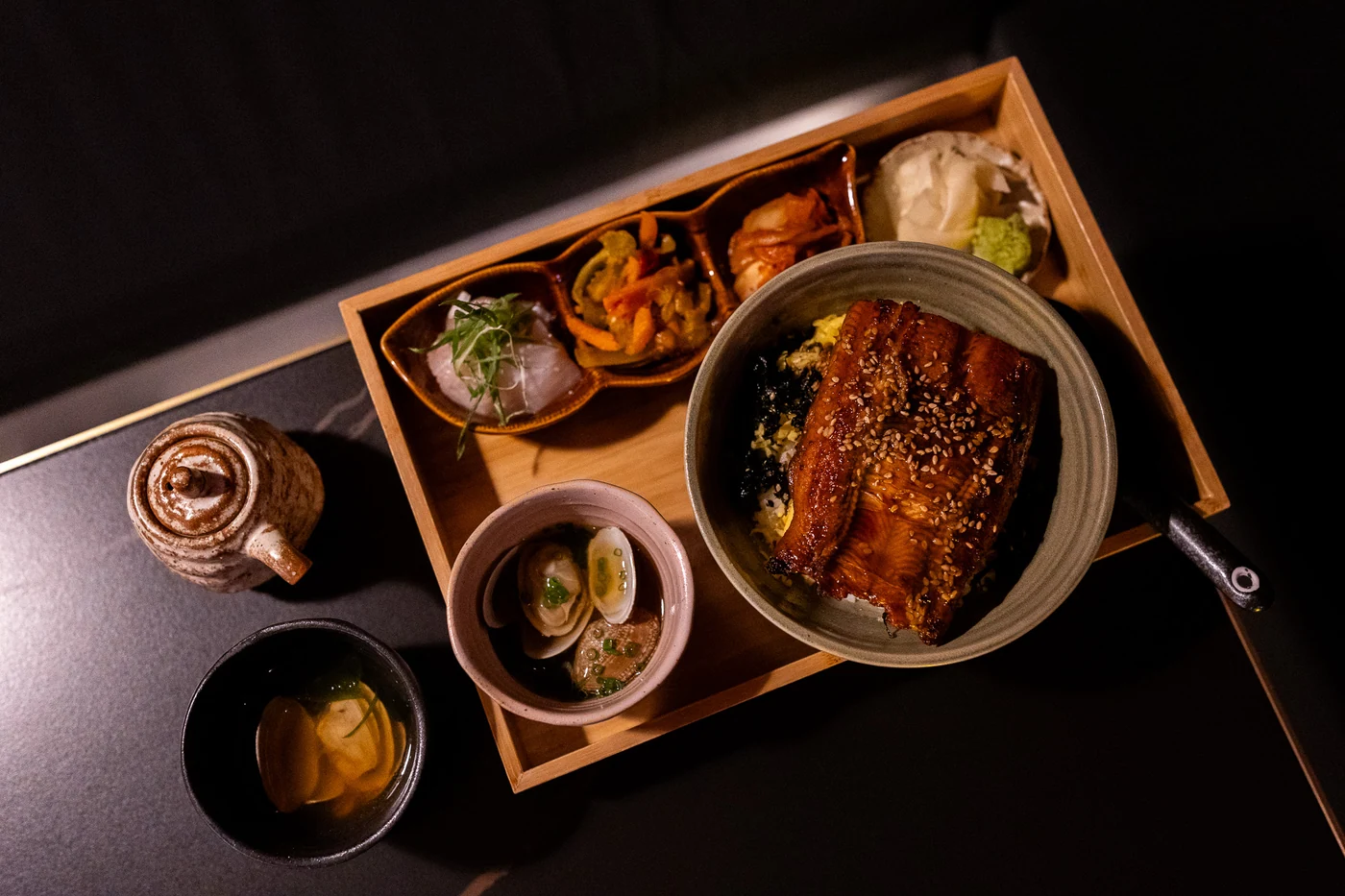 A glazed fillet rice bowl and side dishes at Jaya