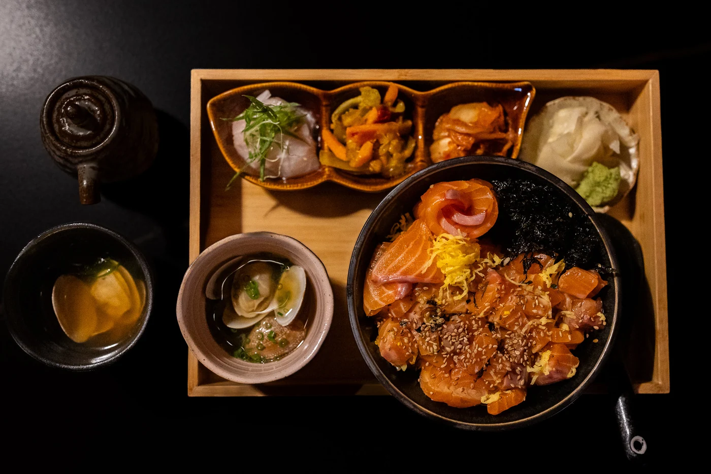 A fish rice bowl served with side dishes at Jaya